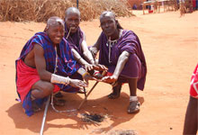 Maasai's making fire by rubbings sticks together