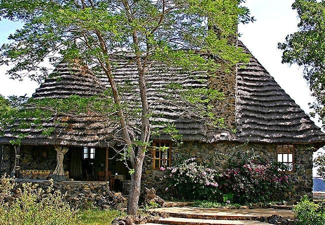 campi-ya-kanzi-camp-luxury-tented-safari-camp-has-thatched-roofed-stone-wood-guesthouses-set-on-private-maasai-land-that-stretches-from-the-chyulu-hills-to-the-foot-of-mount-kilimanjaro Campi ya Kanzi Camp Chyulu Hills Tsavo West National Park Kenya