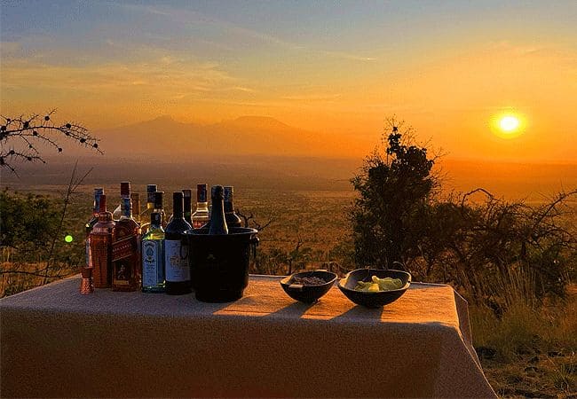 campi-ya-kanzi-camp-luxury-tented-safari-camp-sundowners-overlooking-Kili Campi ya Kanzi Camp Chyulu Hills Tsavo West National Park Kenya