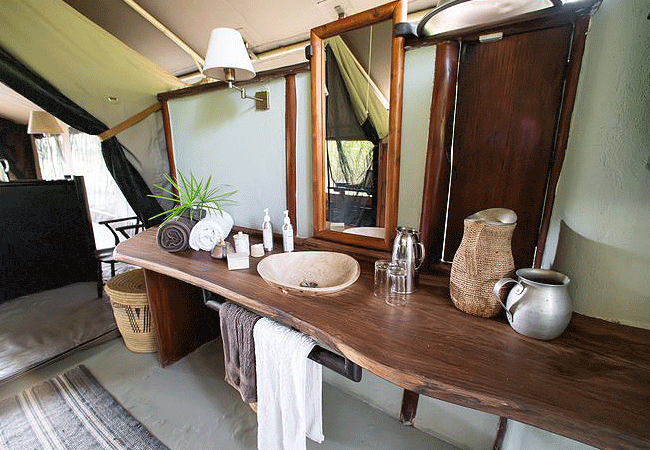 kitich-forest-camp-mathews-range-samburu-spacious-tent-is-lit-with-hurricane-lanterns-and-includes-comfortable-beds-oriental-rugs-and-24-hour-lighting-and-power-from-solar-energy Kitich Forest Camp Mathews Range Samburu Northern Kenya