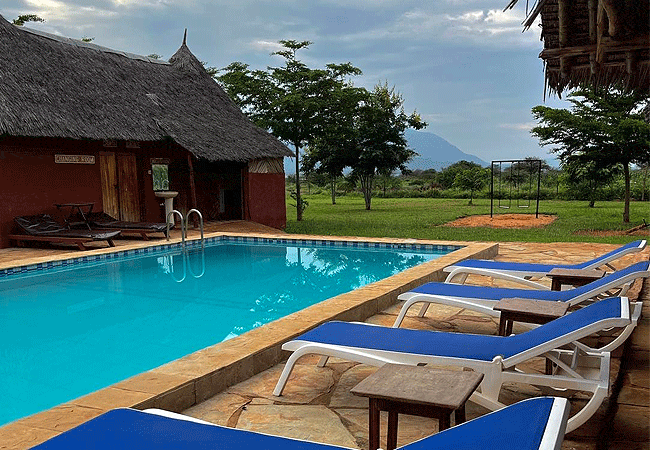 lake-jipe-eco-lodge-offers-an-outdoor-swimming-pool-where-guests-can-cool-down-in-the-hot-tsavo-afternoons Lake Jipe Eco Lodge Tsavo West National Park Kenya