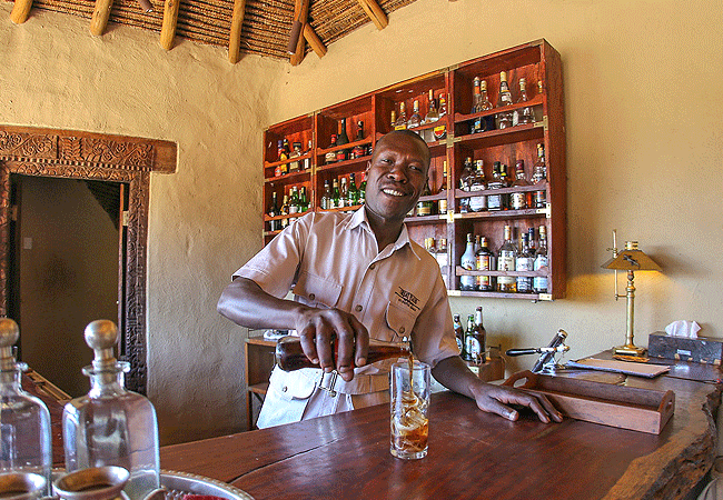 ol-donyo-lodge-chyulu-hills-features-a-welcoming-bar-where-guests-can-relax-and-enjoy-a-refreshing-drink Ol Donyo Lodge Chyulu Hills Kenya Safari