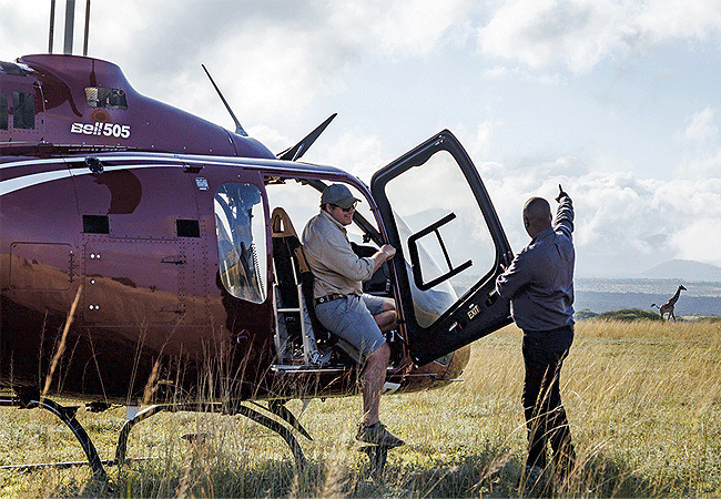 ol-donyo-lodge-chyulu-hills-helicopter-offers-guests-the-chance-to-enjoy-180-degree-views-with-aerial-scenic-tours-of-chyulu-hills-amboseli-national-park-and-mount-kilimanjaro Ol Donyo Lodge Chyulu Hills Kenya Safari