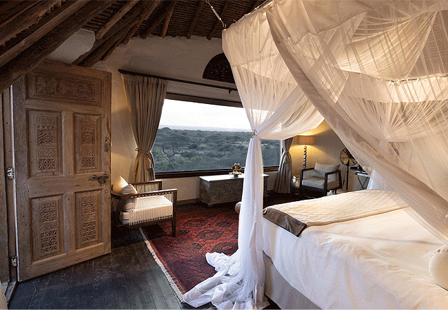 ol-donyo-suites-feature-lounge-verandah-indoor-and-outdoor-showers-an-suite-bathroom-with-double-washbasins-flushes-toilet-and-bath-star-bed-accessed-from-the-verandah-via-a-staircase- Ol Donyo Lodge Chyulu Hills Kenya Safari