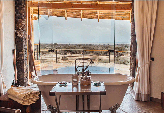 4-days-3-nights-ol-donyo-lodge-chyulu-hills-fly-in-safari-luxurious-suites-each-with-an-en-suite-bathroom-that-includes-both-indoor-and-outdoor-showers-and-a-large-stone-bathtub 4 Days 3 Nights Ol Donyo Lodge Chyulu Hills Fly-in Safari