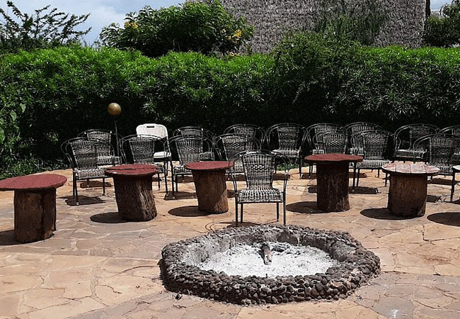 aa-lodge-amboseli-national-park-has-a-bonfire-a-perfect-place-to-socialize-in-the-evening-as-the-barman-prepares-refreshing-cocktails-for-the-guests AA Lodge Amboseli National Park Kenya Safari