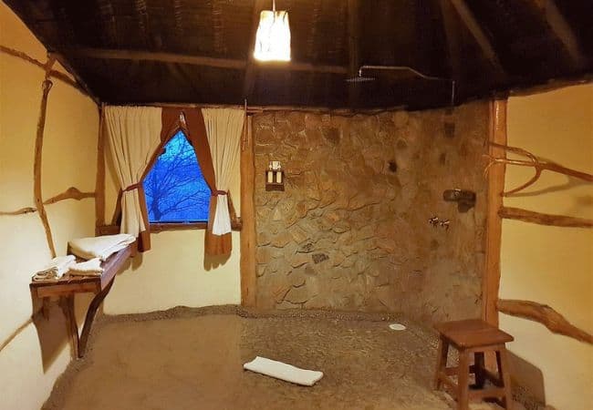 elerai-camp-amboseli-bathrooms-are-designed-using-natural-rock-and-acacia-wood-and-have-their-own-naturally-crafted-bathtub-and-shower Elerai Camp Amboseli National Park Kenya Safari