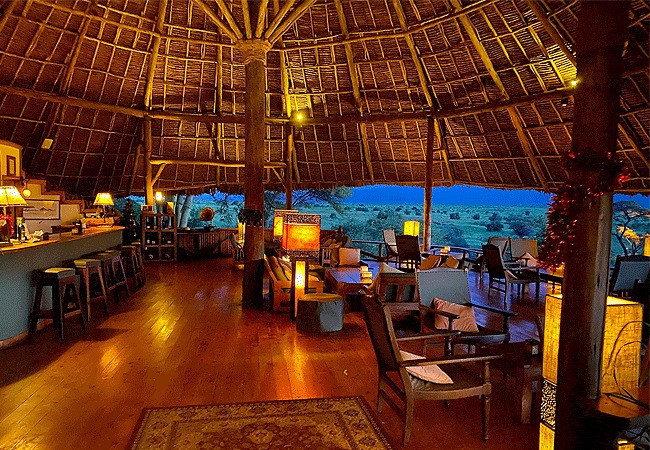 tortilis-camp-amboseli-national-park-guest-areas-of-the-camp-include-a-cosy-sitting-room-bar-and-dining-area-all-exquisitely-furnished-with-natural-materials-and-covered-with-thatched-roofs Tortilis Camp Amboseli National Park | Prices | Facilities & Activities