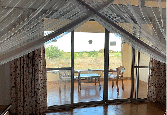 voi-wildlife-lodge -tsavo-east-national-park-luxury-rooms-comprise-two-four-poster-beds and-comfortable-balcony-or-terrace Voi Wildlife Lodge Tsavo East National Park Kenya