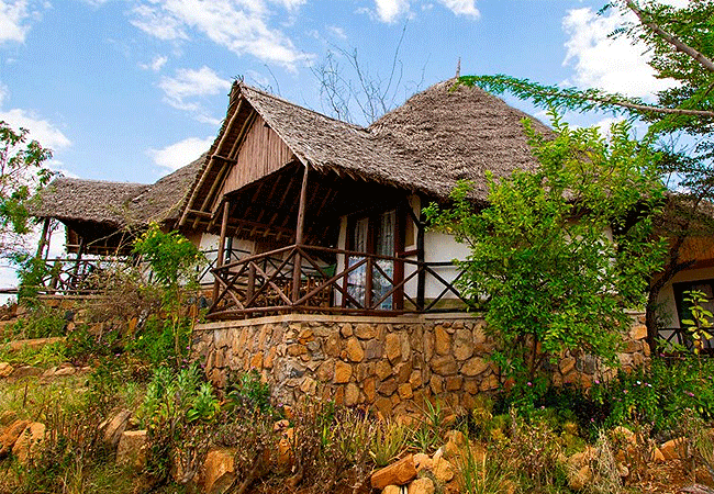 zomeni-lion-hill-lodge-tsavo-east-national-park-guestroom-has-double-or twin-beds-a-mosquito-net-and-a-work-desk Zomeni Lion Hill Lodge Tsavo East National Park