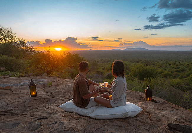 honeymoon-safaris-holidays-at-kipalo-hills-lodge-tsavo-west-national-park-enjoying-sundowners- drinks-and-snacks-while-watching-the sunset Honeymoon Safaris Holidays