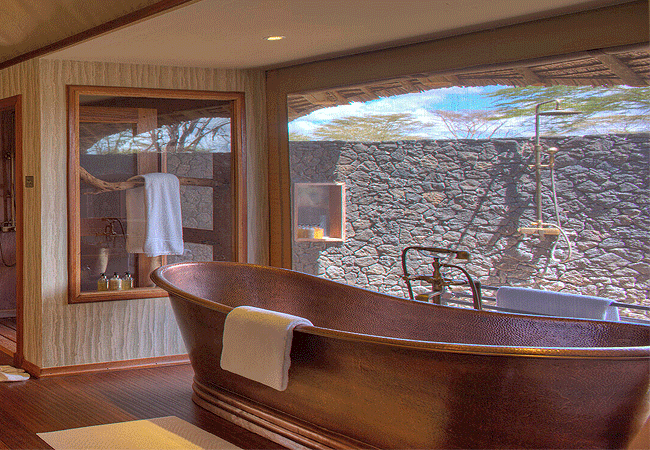 finch-hattons-camp-presidential-suite-tsavo-west-national-park-is-a-spacious-en-suite-bathroom-complete-with-2 outdoor-showers- an-indoor-shower-a-free-standing-copper-bath-tub Finch Hattons Camp Presidential Suite