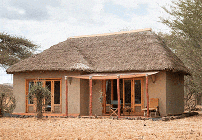 severin-safari-camp-junior-feature-a-king-size-bed-a-separate-living-area-with-a-comfortable-sofa-which-can-be-used-as-a-sofa-bed-for-children Severin Safari Camp Junior Suites Tsavo West National Park