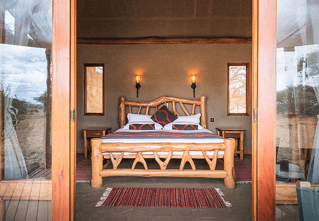 severin-safari-camp-junior-suites-tsavo-west-national-park-features-a-separate-lounge-area-and-a-private-courtyard-with-an-outdoor-shower-offering-privacy-and-a-connection-to-nature Severin Safari Camp Junior Suites Tsavo West National Park