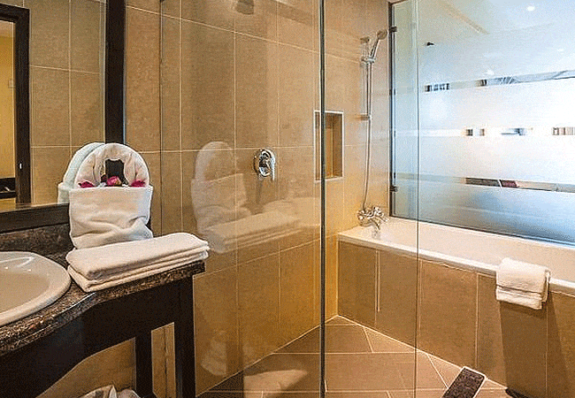 acacia-premier-hotel-kisumu-bathroom-with-a-shower-and-a-sink Acacia Premier Hotel Kisumu