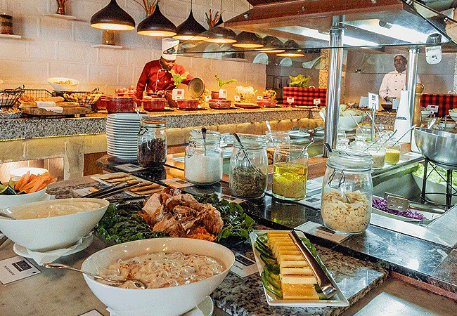muthu-lake-naivasha-country-club-main-dining-venue-is-flavours-restaurant-which-offers-buffet-and-à-la-carte-breakfast-lunch-and-dinner-with-scenic-views-of-the-lush-gardens Muthu Lake Naivasha Country Club