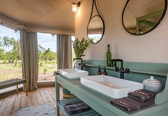 the-river-camp-ol-pejeta-conservancy-laikipia-feature-fully-equipped-private-en-suite-bathrooms-with-running-hot-and-cold-water-modern-vanity-sinks-and-flush-toilets. The River Camp Ol Pejeta Conservancy Laikipia