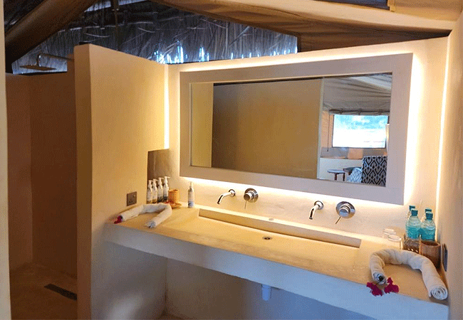 kudu-safari-camp -tsavo-east-national-park-safari-tents-have-a-bathroom-with-two-sinks-and-a-large-mirror Kudu Safari Camp Tsavo East National Park