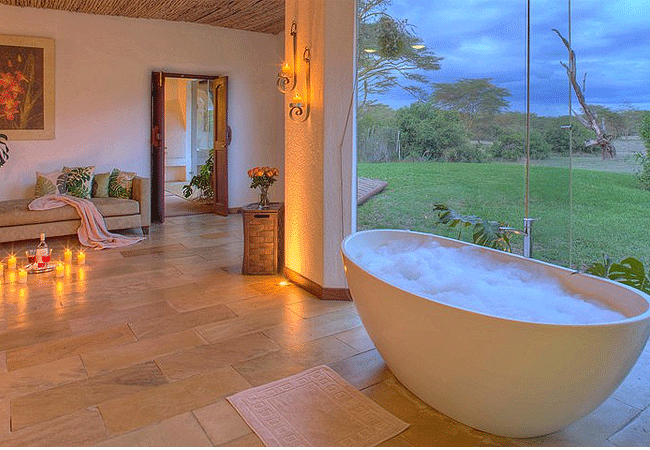 solio-game-reserve-solio-lodge-rooms-have-ensuite-bathrooms-feature-double-sinks-an-inviting-bathtub-and-a-shower Solio Game Reserve