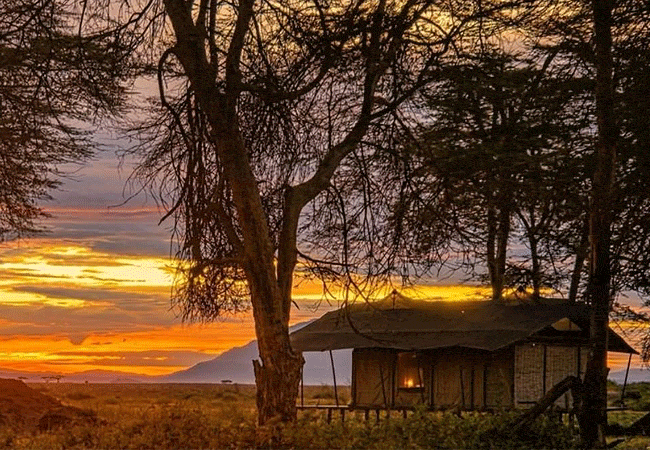 soroi-amboseli-camp-dawn-experience-dual-peak-horizon-unlike-standard-open-plain-lodges-this-camp's unique-orientation-showcases-both-kilimanjaro-and-mount-meru-at-first-light Soroi Amboseli Camp