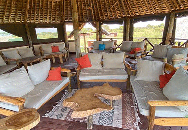 amboseli-discovery-camp-has-12-self-contained-hemingway-style-safari-tents-and-a-lounge-with-an-elevated-platform-for-spectacular-view-of-mt-Kilimanjaro-and-a-busy-watering-hole-nearby Amboseli Discovery Camp | Amboseli National Park | Prices & Activities