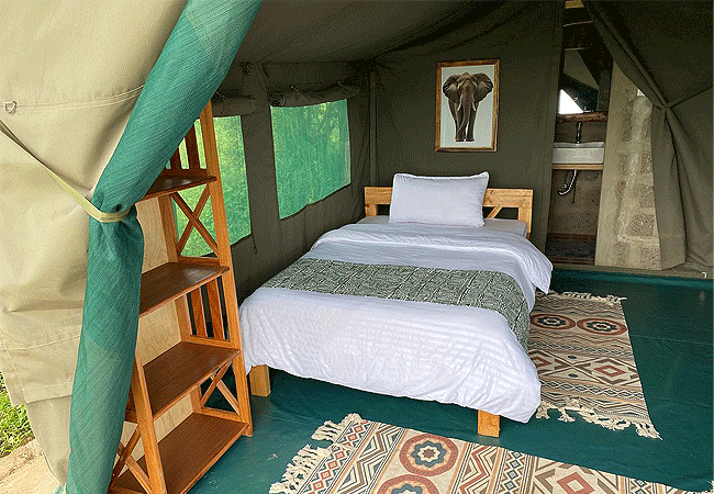 amboseli-discovery-camp-has-a-restaurant-located-right-by-a-watering-hole-and-guests-enjoy-meals-while-they-watch-animals-like- zebras-giraffes-all-in-the-shadow-of-mt-kilimanjaro Amboseli Discovery Camp | Amboseli National Park | Prices & Activities