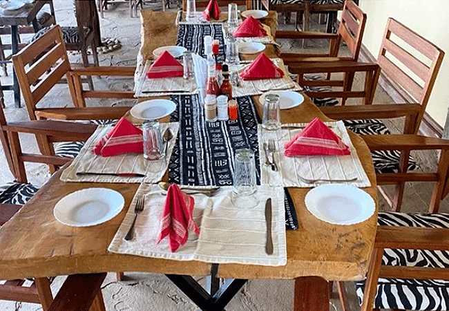 amboseli-discovery-camp-restaurant-is-set-under-a-beautiful-makuti-house-overlooking-the-majestic-mt-kilimanjaro-and-a-very-busy-watering-hole Amboseli Discovery Camp | Amboseli National Park | Prices & Activities