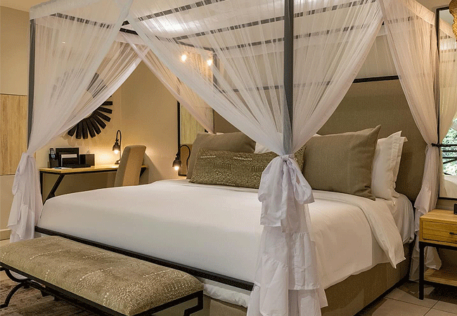 pax-manor-is-a-luxury-hotel-standard-double-room-spanning-an-55-square-meters-features-a-cozy-double-bed-providing-ample-space-for-relaxation-and-rejuvenation Pax Manor Muthaiga Nairobi a luxury heritage hotel