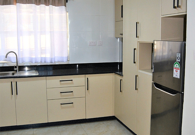 salonika villas boutique serviced apartments lavington nairobi feature fully equipped modern kitchens in their apartments, often styled with an American-open design. These kitchens include a cooker, fridge, microwave, electric kettle, and essential cutlery/crockery, offering guests a fully functional "home away from home" cooking experience.