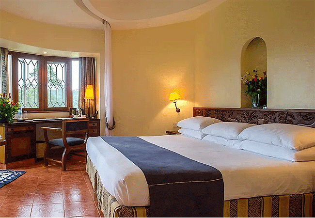 Arusha Serena Hotel is a premium 4-star lakeside retreat nestled on the tranquil slopes of Mount Meru and the shores of Lake Duluti. Originally a colonial-era coffee farm, this charming estate features 42 cottage-style rooms. It serves as a popular gateway for travelers starting or ending a safari through Tanzania's Northern Safari Circuit.
