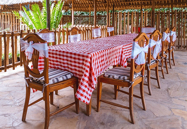 the-last-village-lodge-on-mutungoni-road-in-athi-river-features-a-swahili-themed-open-garden-restaurant-complete-with-traditional-makuti-roofing-outdoor-seating The Last Village Lodge on Mutungoni Road in Athi River