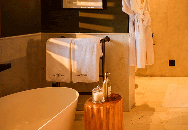 laba-ngorongoro-lodge-bathrooms-feature-modern-en-suite-layouts-equipped-with-both-a-bathtub-and-a-separate-shower-complemented-by-cozy-underfloor-heating-for-the-cool-crater-highlands Laba Ngorongoro Lodge