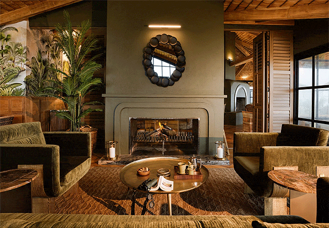 laba-ngorongoro-lodge-formerly-known-as-the-ngorongoro-rhino -lodge-features-a-stunning-designed-main-lounge-centered-around-an-elegant-wood-burning-fireplace Laba Ngorongoro Lodge